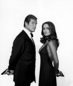 1977 --- Actor Roger Moore and actress Barbara Bach on the set of "The Spy Who Love Me". --- Image by © Sunset Boulevard/Corbis