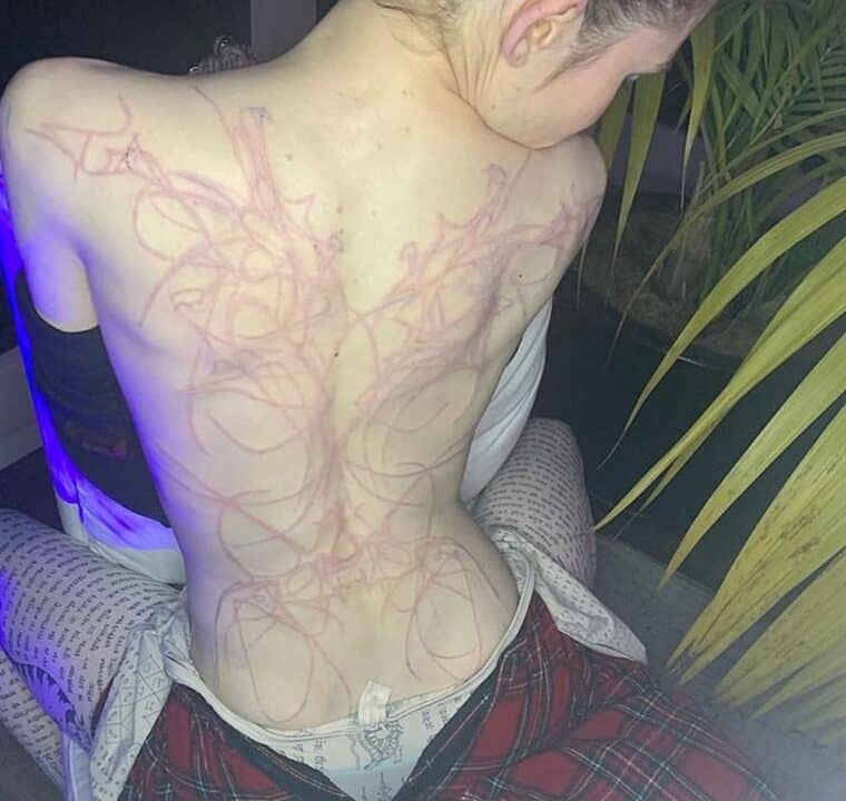 Tatuaggio Grimes sulla schiena